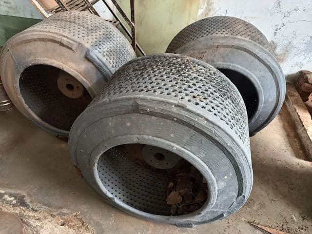 Perforated centrifuge drums ready for the next stage